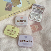 Estuche para lentes de contacto de colores con diseño de niña y lindas mascotas